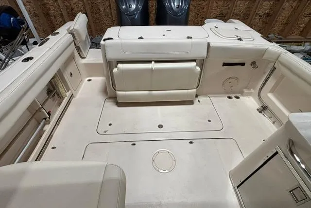 Slide: The Image of 2022 Grady-White Freedom 285 boat interior with spacious seating and storage compartments. - 14