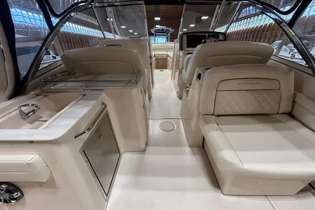 Slide: The Image of 2022 Grady-White Freedom 285 boat interior with luxurious seating and modern amenities. - 16
