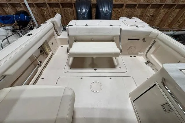 Slide: The Image of 2022 Grady-White Freedom 285 boat interior with seating and storage compartments. - 18