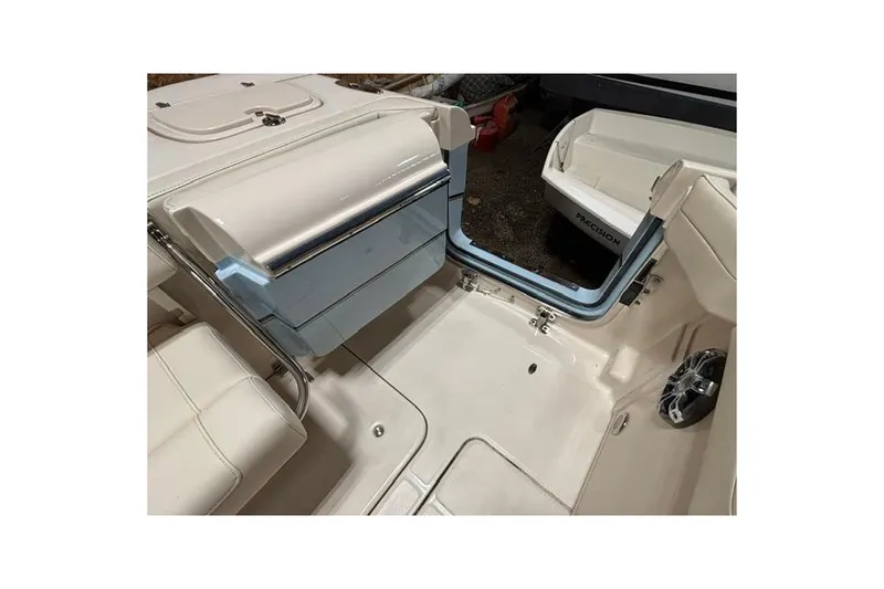 Slide: The Image of 2022 Grady-White Freedom 285 boat interior with seating and storage compartments. - 21