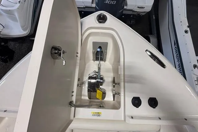 Slide: The Image of 2022 Grady-White Freedom 285 boat anchor compartment with winch and controls. - 5