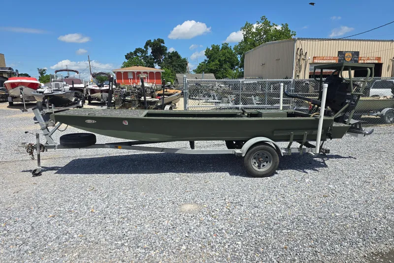 Slide: The Image of 2015 Gator Tail 1854 boat on trailer in outdoor dealership lot. - 9