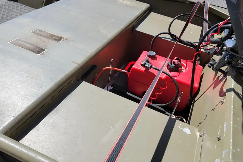 Slide: The Image of 2015 Tracker Topper 1542 LW Jon boat with red fuel tank and wiring. - 8