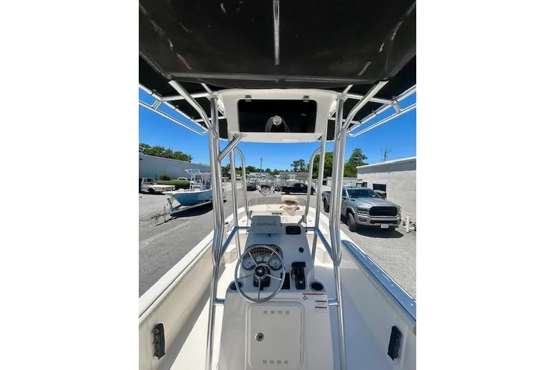 Slide: The Image of 2022 Carolina Skiff 21 LS boat interior with steering console and canopy. - 14