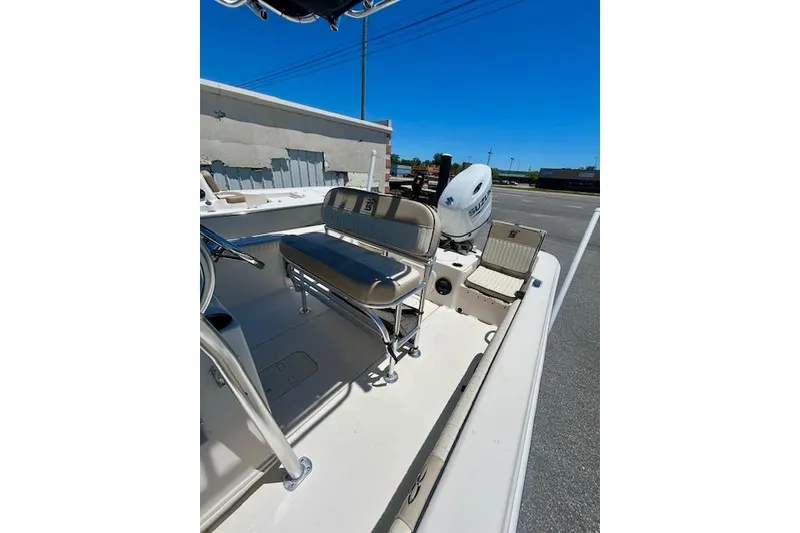 Slide: The Image of 2022 Carolina Skiff 21 LS boat interior with seating and outboard motor. - 16