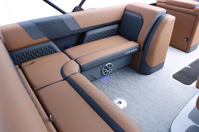 Slide: The Image of Luxurious seating on 2026 Sylvan L3 DLZ Bar Platinum Edition Tri-Toon boat interior. - 22