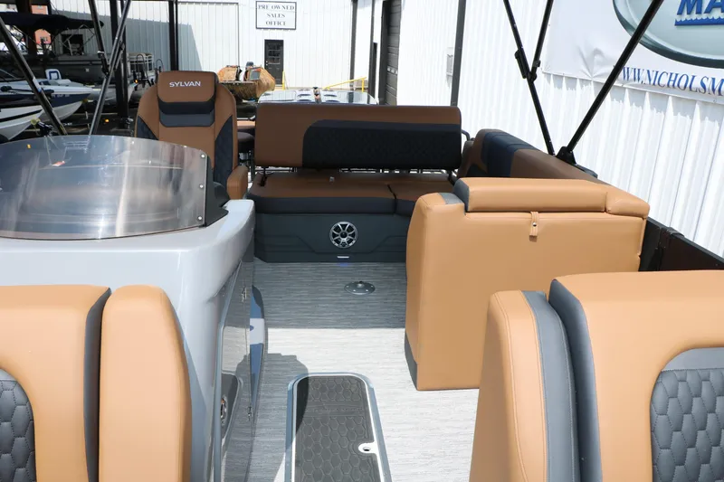 Slide: The Image of 2026 Sylvan L3 DLZ Bar Platinum Edition Tri-Toon interior with tan and gray seating. - 39