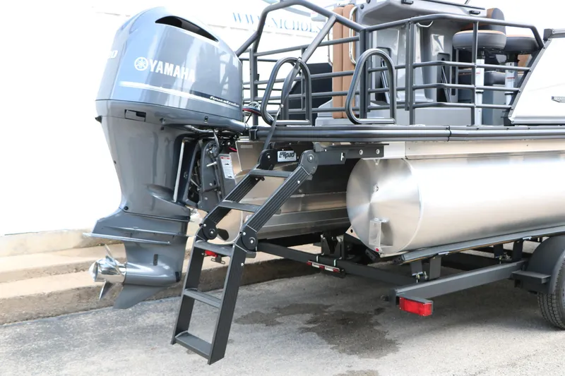 Slide: The Image of 2026 Sylvan L3 DLZ Bar Platinum Edition Tri-Toon with Yamaha outboard motor. - 8
