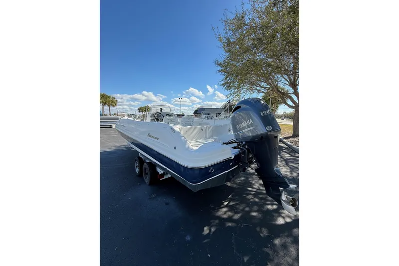 Slide: The Image of 2015 Hurricane SunDeck Sport CC 231 OB boat with Yamaha outboard motor on trailer. - 6