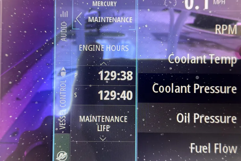 Slide: The Image of Dashboard display of a 2023 Bertram 28 CC showing engine hours and maintenance data. - 19