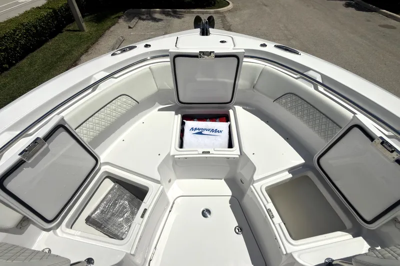 Slide: The Image of 2023 Bertram 28 CC boat interior with open storage compartments. - 24