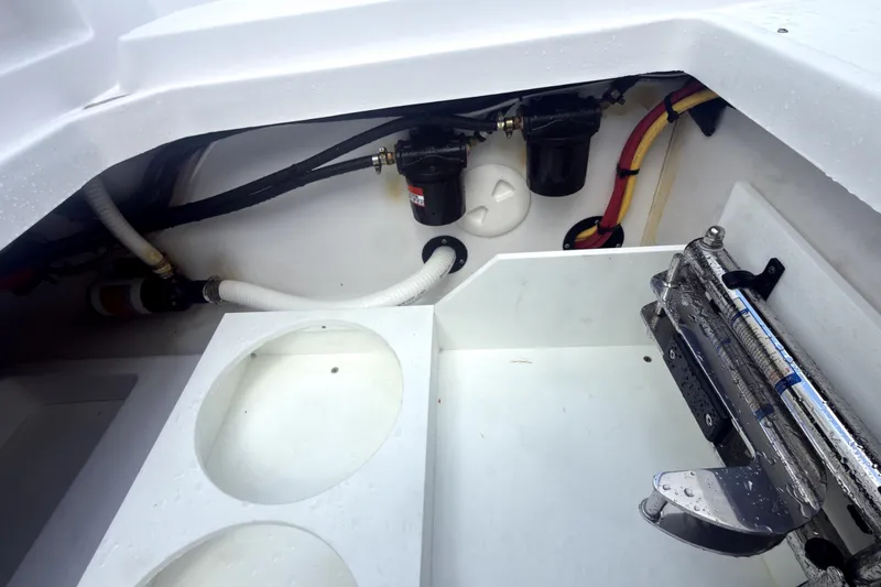 Slide: The Image of 2023 Bertram 28 CC boat interior showing engine compartment and wiring details. - 33