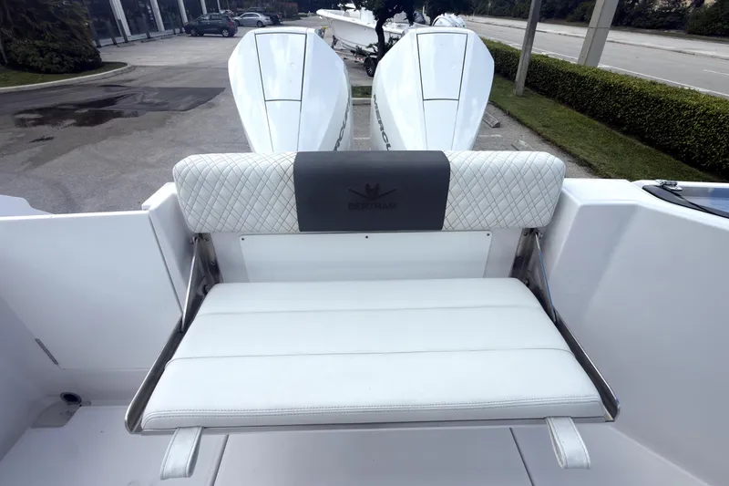 Slide: The Image of 2023 Bertram 28 CC boat with dual engines and cushioned seating. - 35