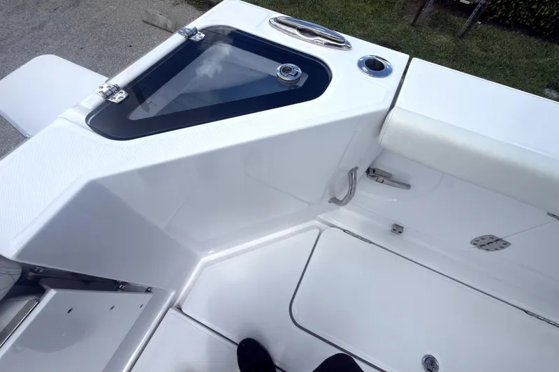 Slide: The Image of 2023 Bertram 28 CC boat deck with storage and seating area. - 38