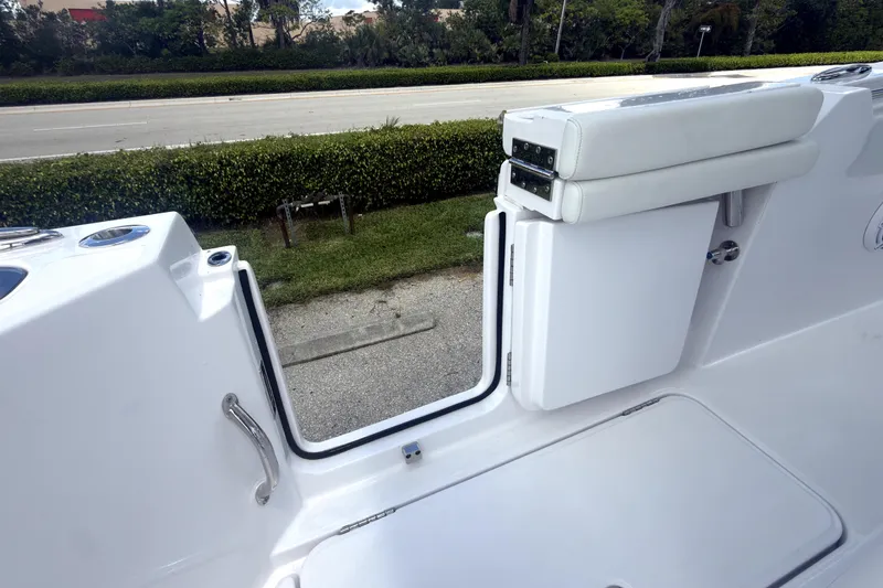 Slide: The Image of 2023 Bertram 28 CC boat interior with open side door and seating. - 39