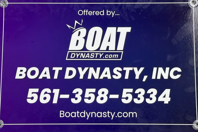 Slide: The Image of Boat Dynasty contact sign with phone number and website for Bertram 28 CC, 2023 model. - 41