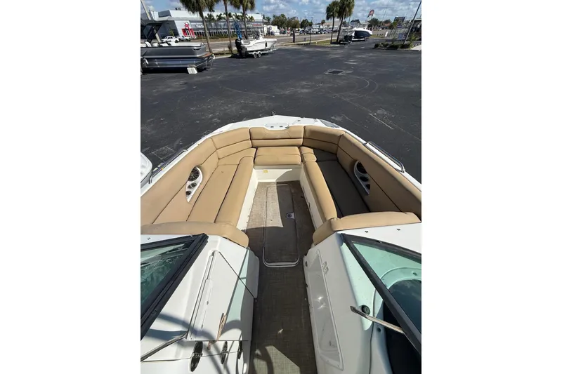 The Image of 2020 NauticStar 243 DC boat with spacious tan seating and sleek design. - 0