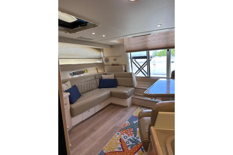 Slide: The Image of Interior of 1998 Carver 350 Mariner yacht with cozy seating and colorful decor. - 22