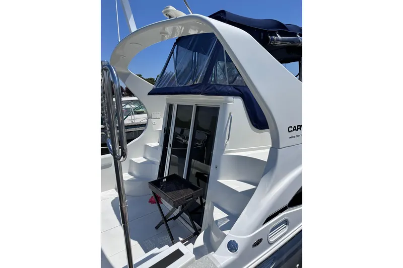 Slide: The Image of 1998 Carver 350 Mariner yacht with sleek design and spacious deck area. - 3