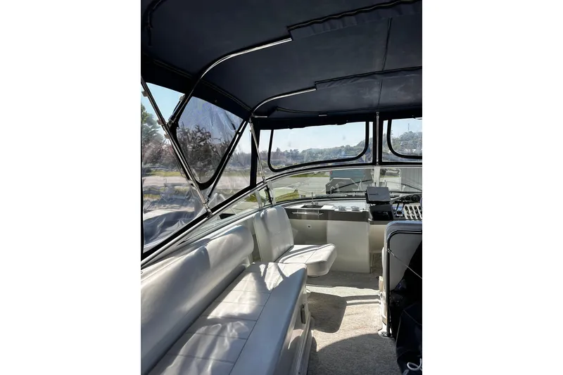 Slide: The Image of Interior view of 1998 Carver 350 Mariner yacht with seating and helm. - 7
