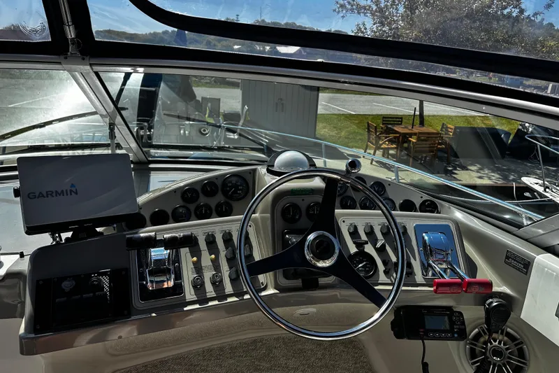 Slide: The Image of 1998 Carver 350 Mariner helm with Garmin navigation system and control panel. - 8
