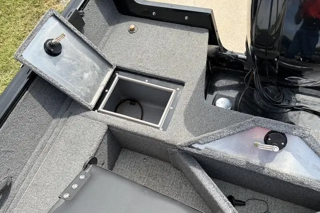 Slide: The Image of 2020 Tracker Pro Deep V-16 boat interior with open storage compartment. - 14
