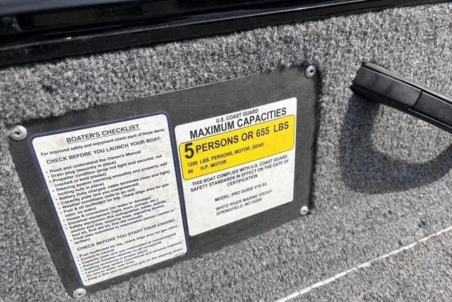 Slide: The Image of 2020 Tracker Pro Deep V-16 boat capacity label, 5 persons or 655 lbs limit. - 19