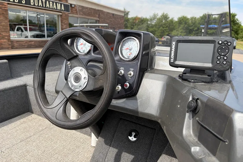 Slide: The Image of 2020 Tracker Pro Deep V-16 console with steering wheel and Lowrance fish finder. - 22