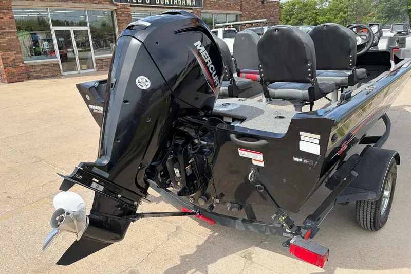 Slide: The Image of 2020 Tracker Pro Deep V-16 boat with Mercury outboard motor, parked outdoors. - 4
