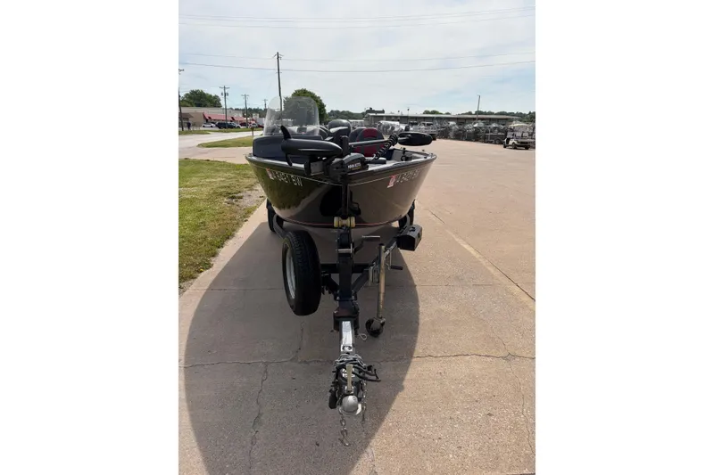 Slide: The Image of 2020 Tracker Pro Deep V-16 Single Console boat on trailer in parking lot. - 7