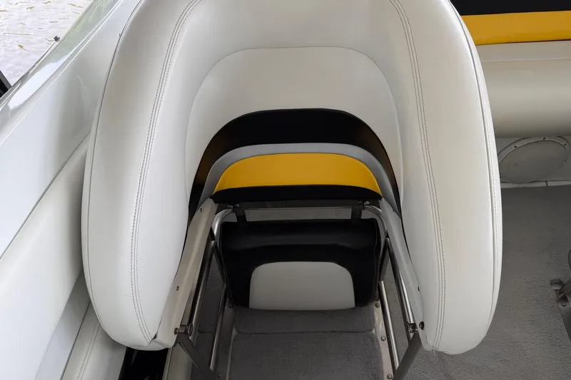 Slide: The Image of White and yellow seating in 2001 Baja 33 Outlaw boat interior. - 10