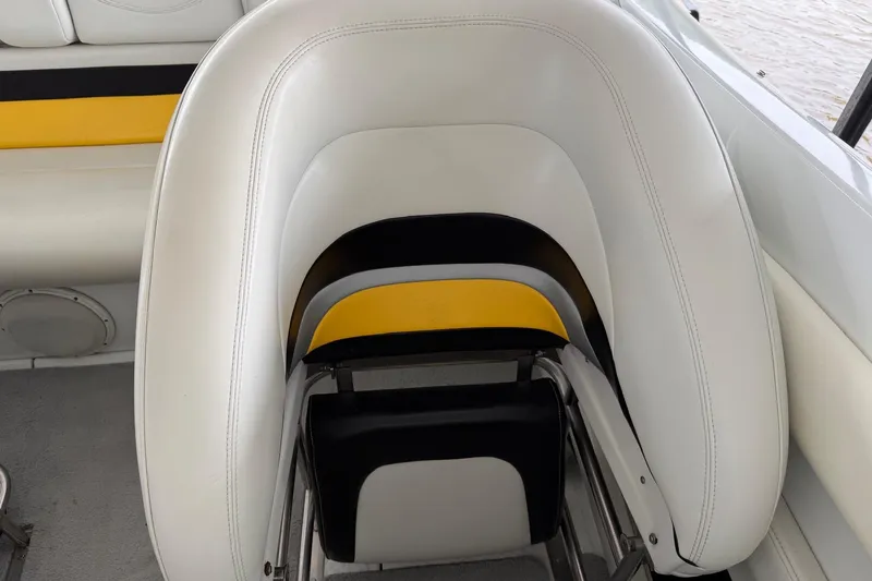 Slide: The Image of White and yellow seating on a 2001 Baja 33 Outlaw boat interior. - 11