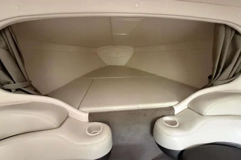 Slide: The Image of Interior cabin of a 2001 Baja 33 Outlaw boat with cushioned seating. - 18