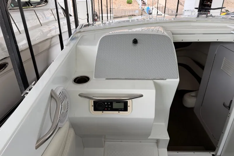 Slide: The Image of 2001 Baja 33 Outlaw boat interior with control panel and seating area. - 7