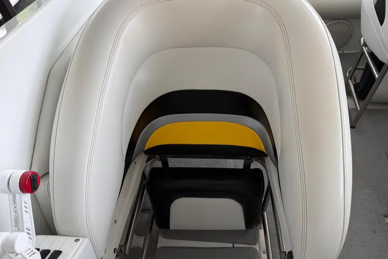 Slide: The Image of White and yellow seating on a 2001 Baja 33 Outlaw boat. - 9
