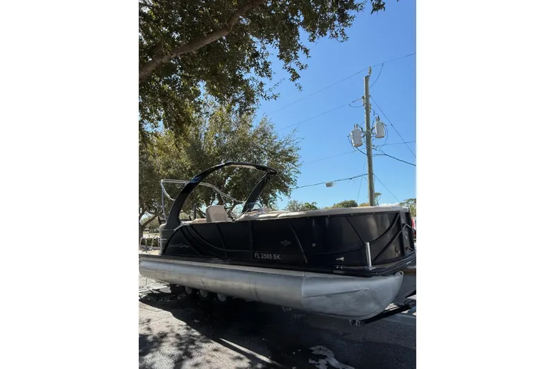The Image of 2017 South Bay 523RS pontoon boat parked under trees on a sunny day. - 1