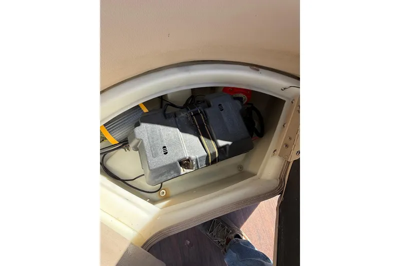 Slide: The Image of Battery compartment of a 2017 South Bay 523RS boat, showing wiring and components. - 15