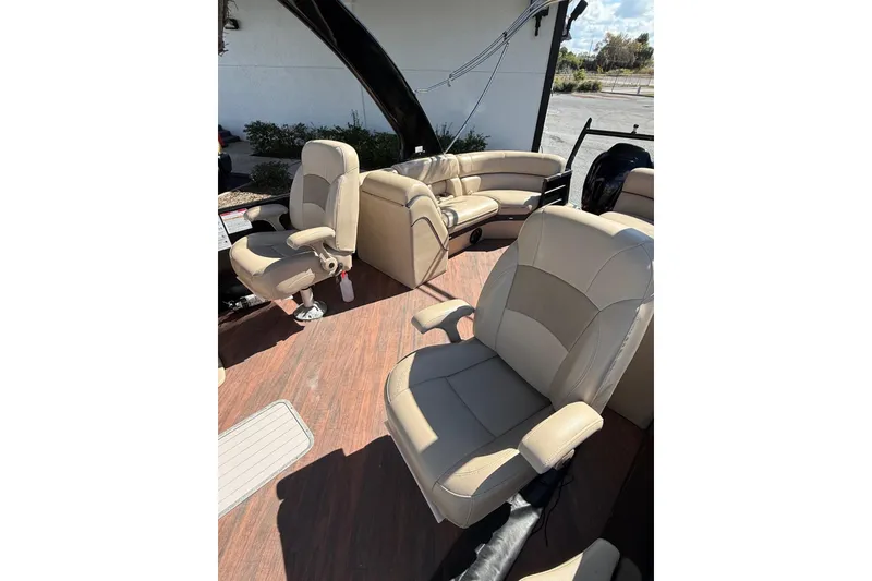 Slide: The Image of 2017 South Bay 523RS boat interior with beige seating and wood flooring. - 19