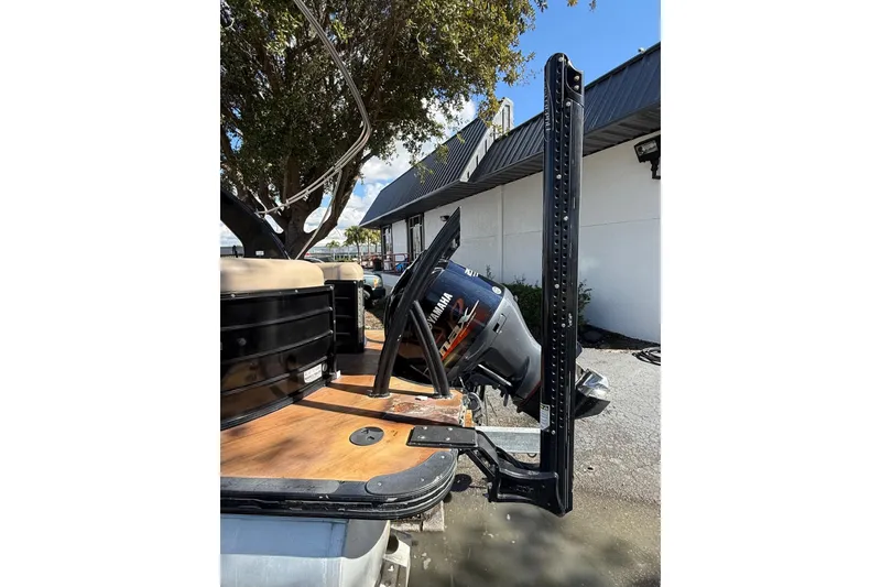 Slide: The Image of 2017 South Bay 523RS pontoon boat with Yamaha outboard motor, docked outdoors. - 4