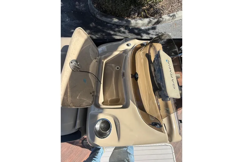 Slide: The Image of 2017 South Bay 523RS boat console with Garmin navigation system and open storage compartment. - 6