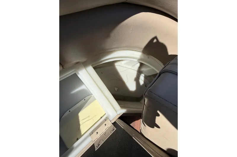 Slide: The Image of Interior view of a 2017 South Bay 523RS boat, showing seating and storage compartment. - 7