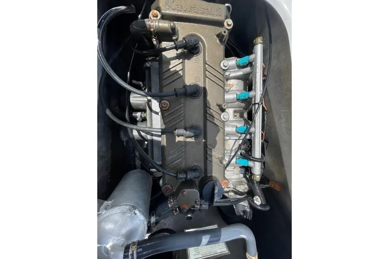 Slide: The Image of 2010 Kawasaki Jet Ski STX-15F engine close-up, showcasing intricate components and wiring. - 8