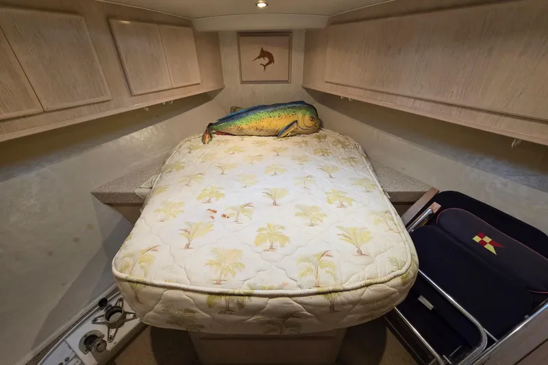 Slide: The Image of Cozy cabin interior of 2003 Henriques 35 Sportfisherman with tropical bedding and fish decor. - 18