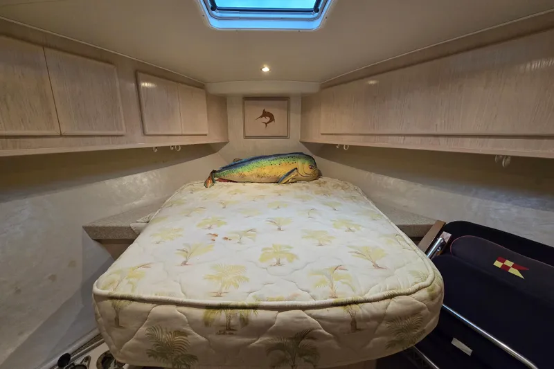 Slide: The Image of Cozy cabin interior of 2003 Henriques 35 Sportfisherman with bed and fish decor. - 19