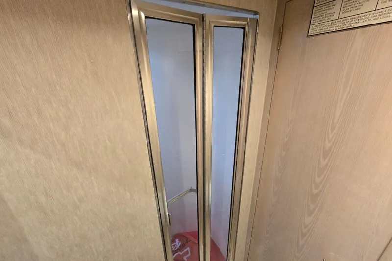 Slide: The Image of Interior view of 2003 Henriques 35 Sportfisherman with wooden paneling and folding door. - 24
