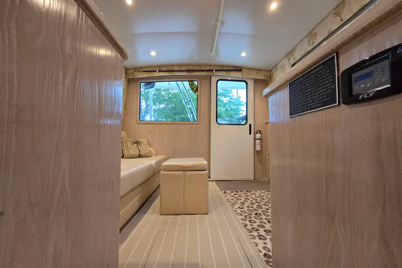 Slide: The Image of Interior of 2003 Henriques 35 Sportfisherman with beige seating and modern amenities. - 25