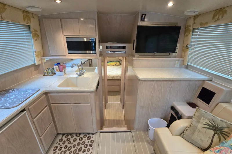 Slide: The Image of Interior of a 2003 Henriques 35 Sportfisherman with modern kitchen and cozy seating area. - 30