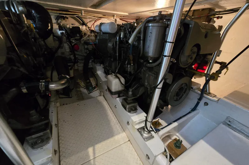Slide: The Image of Engine room of a 2003 Henriques 35 Sportfisherman, showcasing mechanical components and layout. - 36