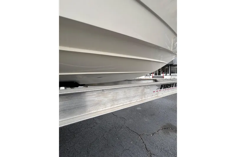 Slide: The Image of 2021 Pathfinder 2300 HPS boat hull on trailer, close-up view. - 10
