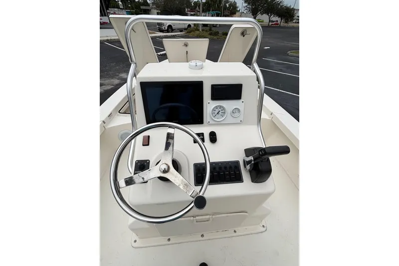 Slide: The Image of Steering console of 2021 Pathfinder 2300 HPS boat with gauges and controls. - 13